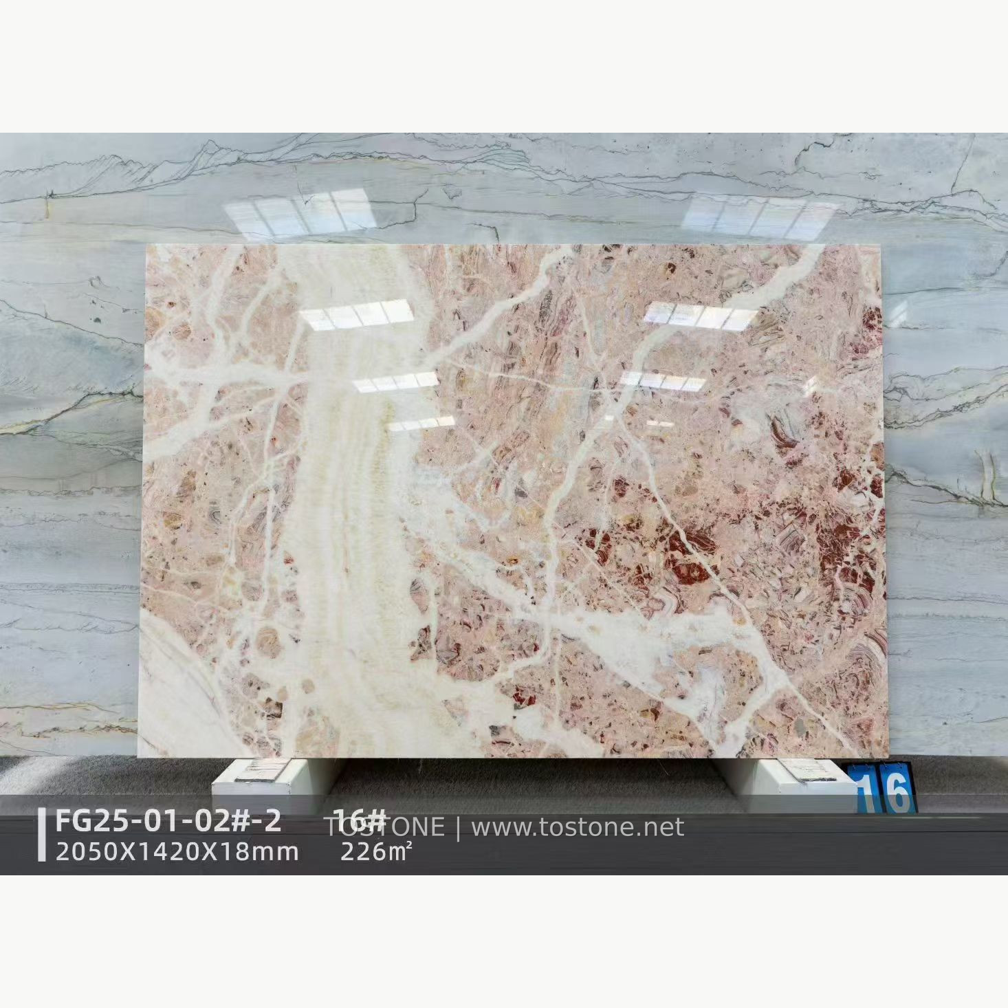 Rosa Picasso marble slab with pale pink areas and broad branching cream-white veins