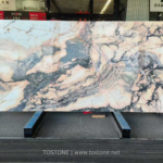 Portuguese Calacatta Rosa marble slab with pink and cream areas and sweeping grey veins