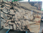 Portuguese Calacatta Rosa marble slab with a dense dark vein network around pale areas