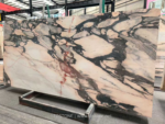 Portuguese Calacatta Rosa marble slab with branching charcoal and reddish veins