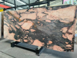 Portuguese Calacatta Rosa marble slab with strong charcoal areas and peach accents