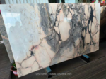 Angled Portuguese Calacatta Rosa marble slab with pale pink and grey patterning