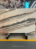 Angled Portuguese pink marble slab with cream and peach areas and sweeping dark diagonal veins