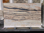 Portuguese pink marble slab with pale pink and ivory areas crossed by horizontal charcoal-grey veins