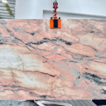Full Portuguese pink marble slab with blush pink and ivory patches and expressive charcoal-grey veining