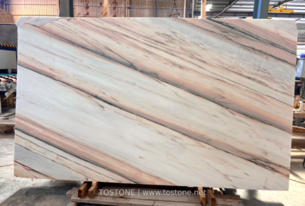 Portuguese pink marble slab with soft pink and ivory tones and fine diagonal grey and rose-colored veins
