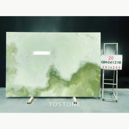 Qing Yu Marble slab with a pale ivory upper field and olive-green clouds along the lower edge