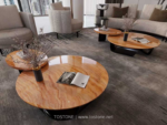 Design reference showing gold and peach banded stone tabletops in a seating area