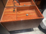 Red Travertine sink design example with warm layered stone pattern
