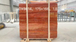 Red Travertine slab bundle with vivid red and golden bands