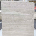 Upright Italian Roma Travertine slab with pale cream horizontal layers