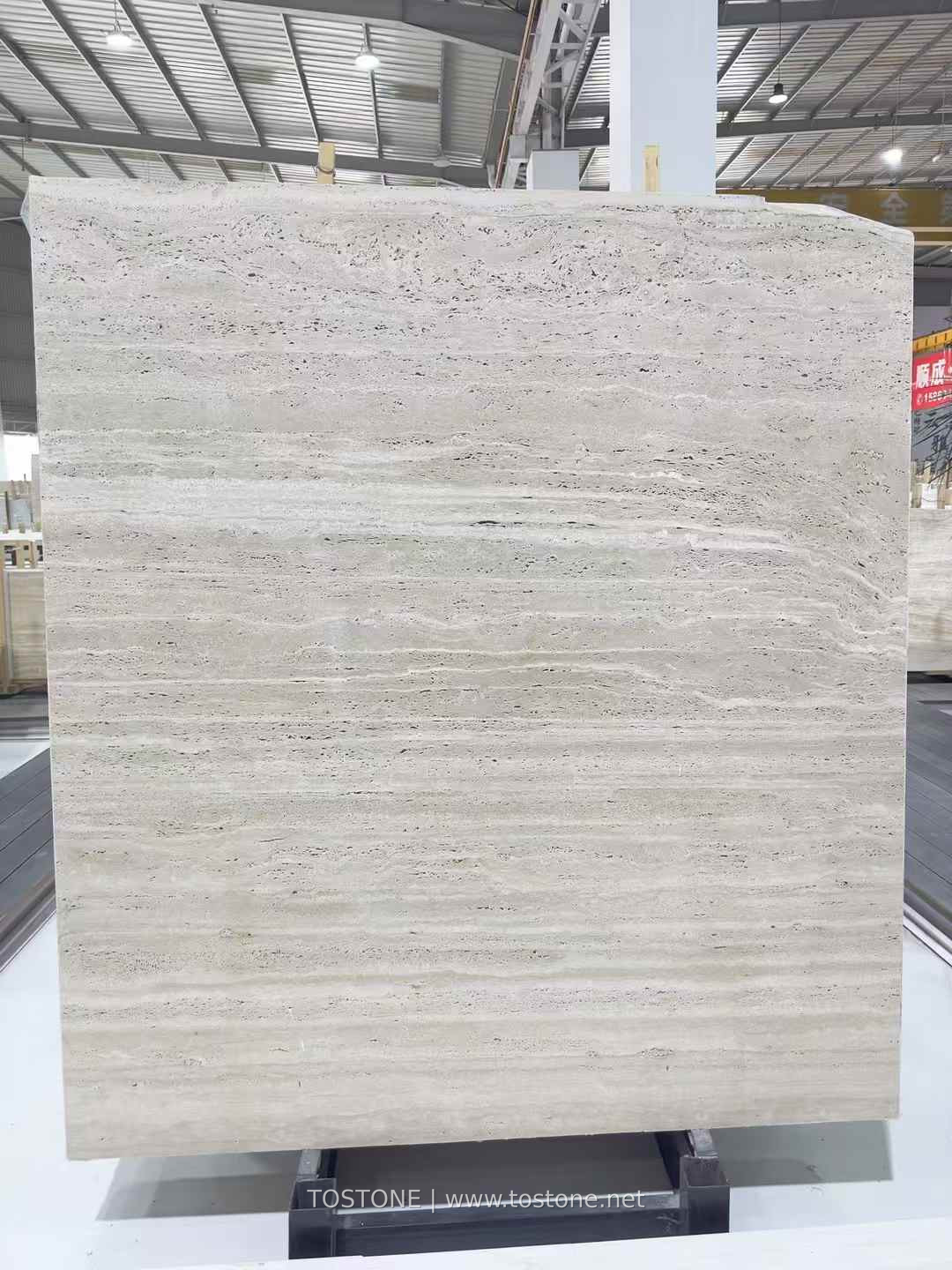 roma-travertine-vein-cut-slab-01-tostone Upright Italian Roma Travertine slab with pale cream horizontal layers