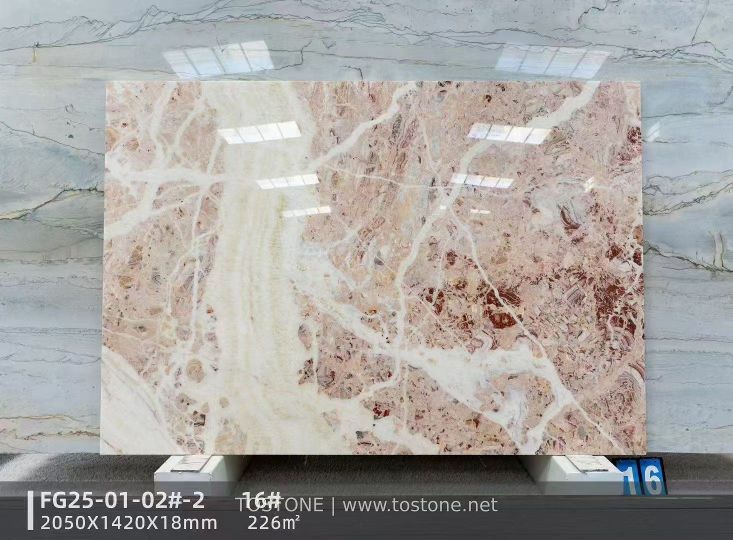 rosa-picasso-marble-slab-01-tostone Rosa Picasso marble slab with pale pink areas and broad branching cream-white veins