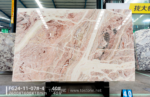 Rosa Picasso marble slab with rose accents and diagonal white veining