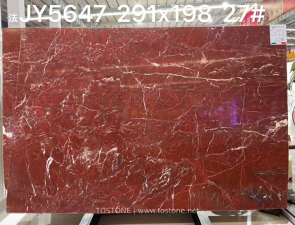 Rouge du Roi marble slab with red background and branching cream veins
