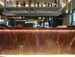 Design reference showing red veined stone on a bar front