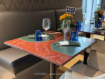Design reference showing a warm red veined stone tabletop