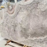 Angled Iranian cross-cut Silver Travertine slab with cloud-like grey and taupe pattern