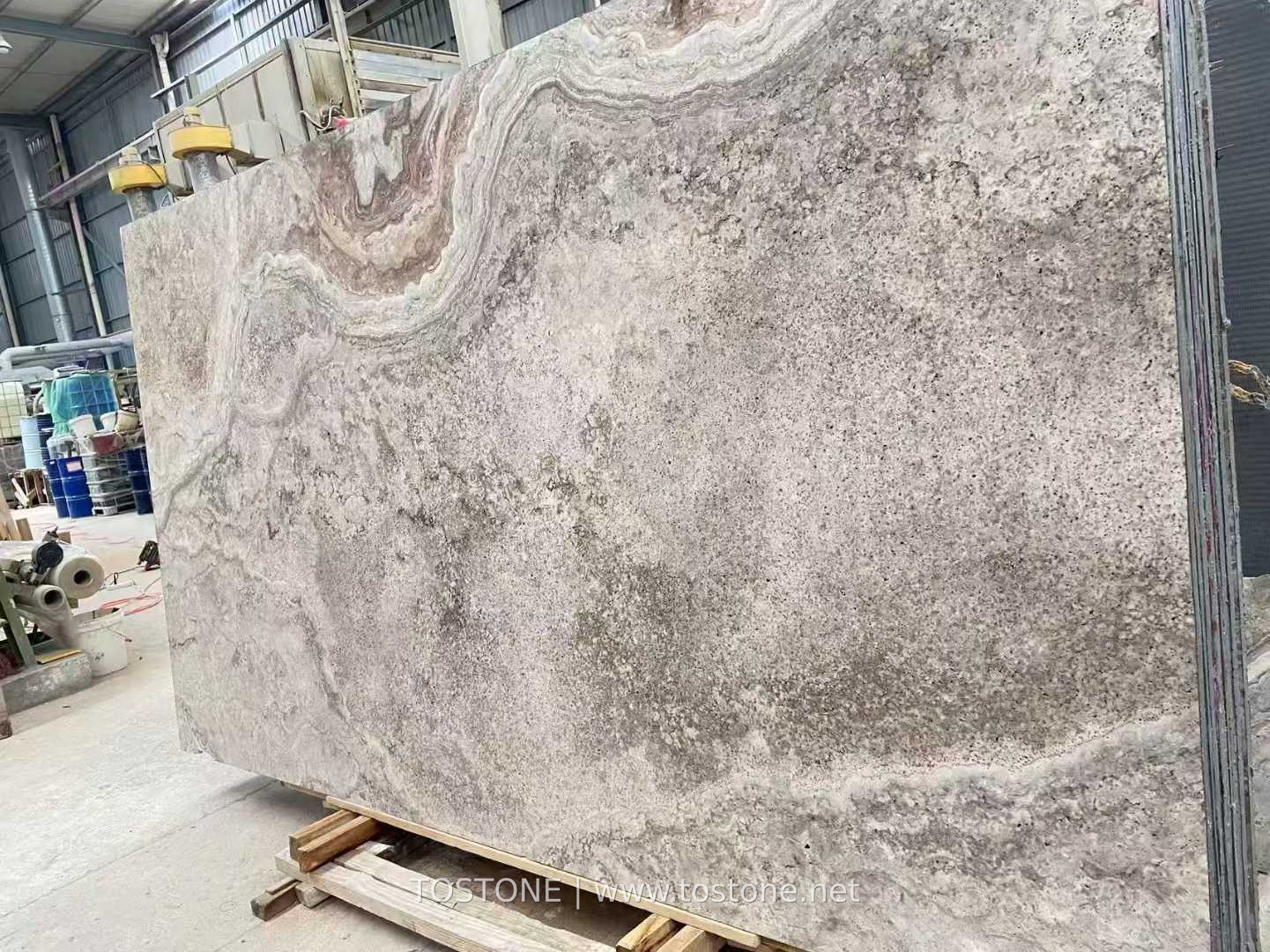 silver-travertine-slab-cross-cut-01-tostone Angled Iranian cross-cut Silver Travertine slab with cloud-like grey and taupe pattern