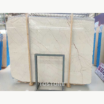Front view of Sofitel Gold Marble showing intersecting diagonal veins and a darker branching vein on the right.