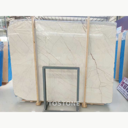 Front view of Sofitel Gold Marble showing intersecting diagonal veins and a darker branching vein on the right.