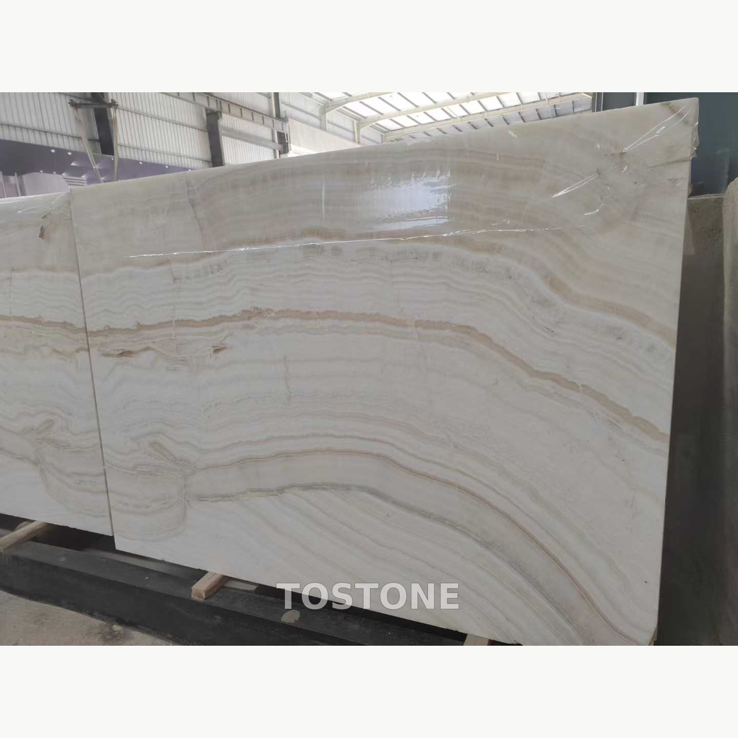straight-vein-white-jade-marble-01-clean-square Straight Vein White Jade Marble slab with closely spaced white, grey and beige bands flowing horizontally across the surface.
