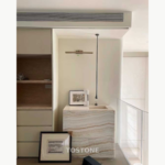 Interior reference showing a compact basin unit with layered white, grey and beige Straight Vein White Jade Marble patterning.