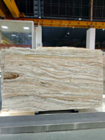 Tilamisu Travertine Slab displayed in a warehouse with fine layered veining