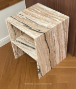 Design reference showing a stone side table with cream, brown and charcoal bands