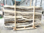 Tilamisu Travertine slabs in a timber frame with bold dark and cream layers