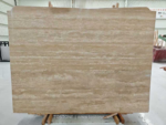 Front view of a Turkish cream travertine slab with warm beige tones and flowing ivory horizontal bands