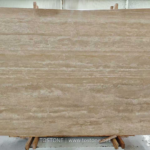 Front view of a Turkish cream travertine slab with warm beige tones and flowing ivory horizontal bands