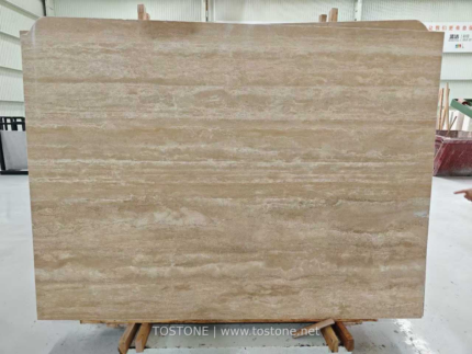 Front view of a Turkish cream travertine slab with warm beige tones and flowing ivory horizontal bands