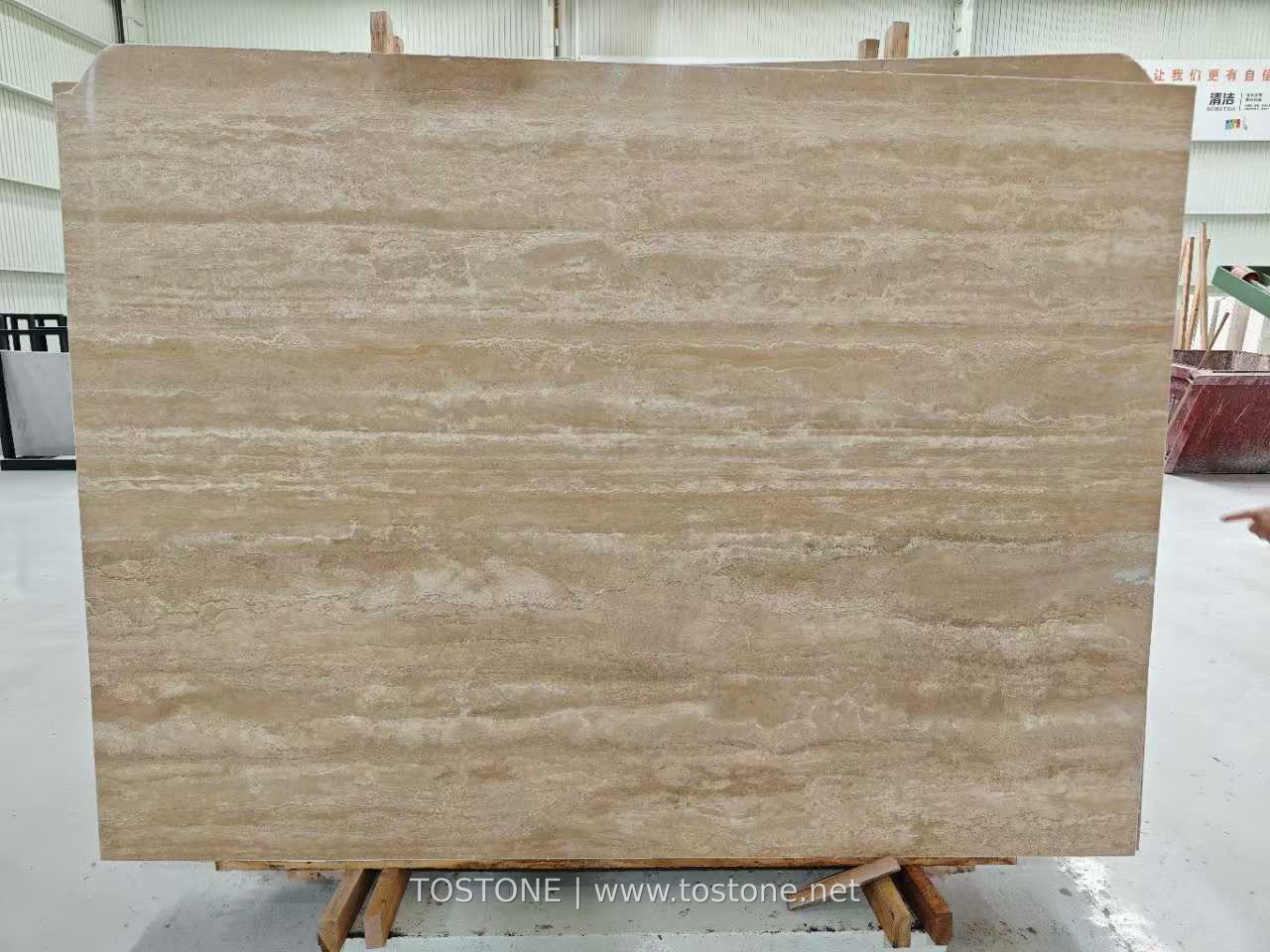 Turkish Cream Travertine Slab Front View Front view of a Turkish cream travertine slab with warm beige tones and flowing ivory horizontal bands