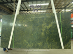 Verde Fantastico marble slab with deep green areas and lighter flowing veins