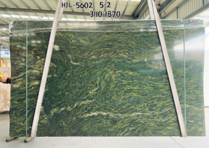 Verde Fantastico marble slab from Brazil with layered flowing green and olive veins