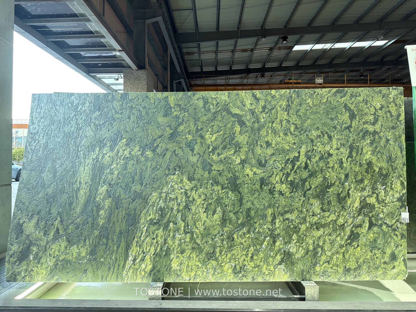 Verde Fantastico Marble Slab Front View Verde Fantastico marble slab from Brazil with deep green and olive-gold natural veining