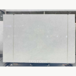 Front view of a Vietnam Crystal White Marble slab with a softly mottled white surface and fine grey flecks