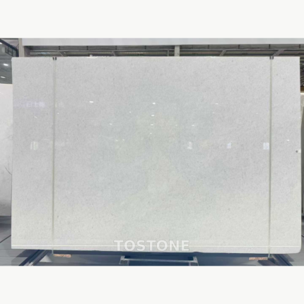 Front view of a Vietnam Crystal White Marble slab with a softly mottled white surface and fine grey flecks