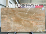 Weimi Pink marble slab with peach accents and flowing cream veins
