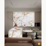 Interior design reference showing White Crystal Marble with an illuminated backsplash and island in a neutral-toned kitchen.