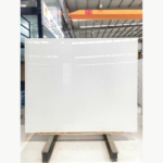 Front view of a Ya Shi White Jade Marble slab with a bright white background and subtle grey flecks